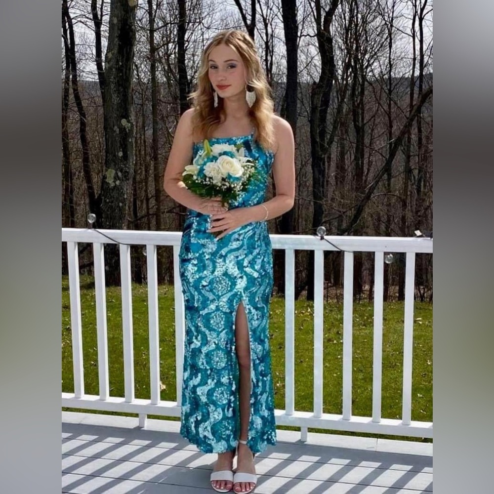 Precious Formals long blue sparkle prom dress will fit size 2/4.